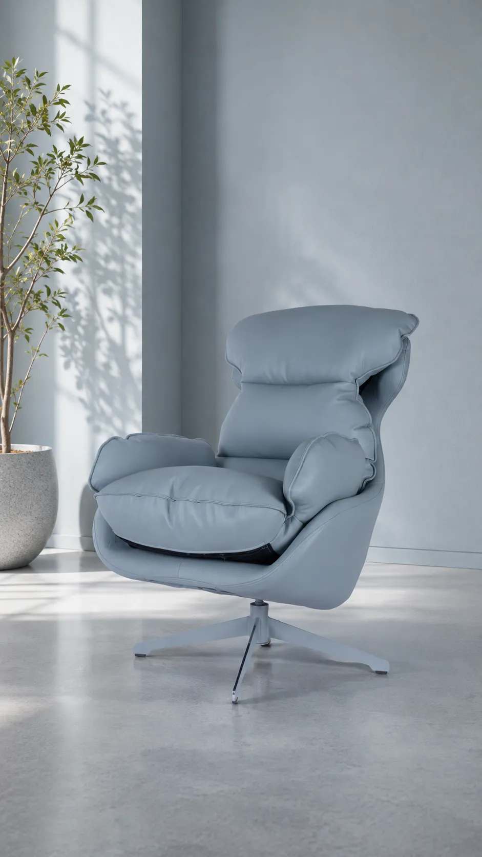A blue high-back lounge chair beside a window